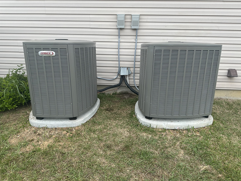 About Us Image Air conditioner units outside house